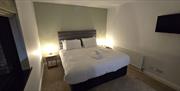 Image of the bedroom at night with side lamps switched on