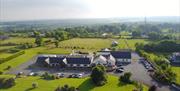 Image shows aerial view of the hotel and grounds