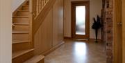 Hallway with wooden staircase