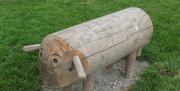 A decorative log animal with horns.