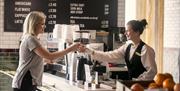 Customer buying coffee at The Galley Café in Titanic Belfast