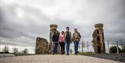 Two couples exploring Hill of the O'Neill