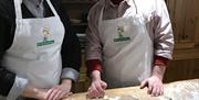 A couple pose with their freshly made soda bread