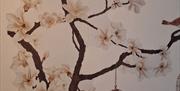 Painted cherry blossom and birds image on a wall