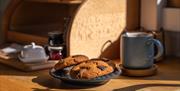 Freshly baked chocolate cookies and coffee cup