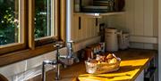 Hut interior kitchen area with freshly baked croissants