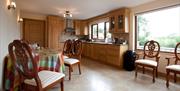 kitchen and dining area with table and 6 chairs