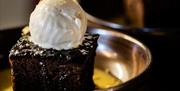 Chocolate dessert with ice cream on plate