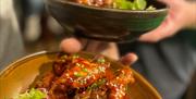 Chicken wings on plate and being served