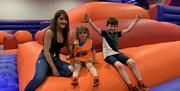 A family posing together in the Inflata park