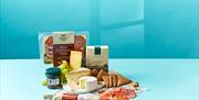 A selection of meats and cheeses on display.