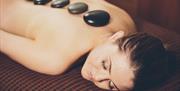 Lady enjoying a hot stone massage