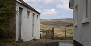 outside image of back of house with scenic view of mountains