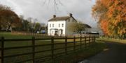 Outside photo of Kilcronaghan Centre with laneway and large grass area