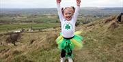 Girl climbing Slemish on St Patricks Day