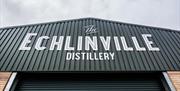 Photo of The Echlinville Distillery sign on exterior of building