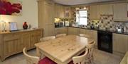 kitchen and dining area with table and 6 chairs