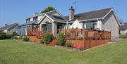 Back of Cairnview Bed and Breakfast with a decking and view of conservatory.