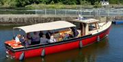 MV Kingfisher River Boat departing from the jetty