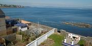 Garden, decking area and view out to sea