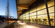 Image of the external of Bangor Aurora showing the gym lit up in the evening