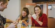 People enjoying painting pottery