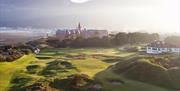 Image showing Royal County Down Golf Course and Slieve Donard Resort and Spa, with Slieve Donard mountain in the background.