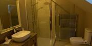 Bathroom with shower, toilet and sink