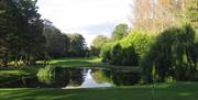 Image is of golf course with lake around it