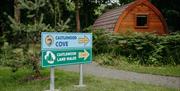 beach and woodland walk signs