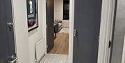Image of the hallway and a framed Giants Ice Hockey shirt