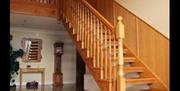 Hallway with wooden staircase