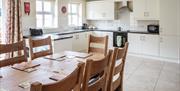 Dining table in a cream kitchen