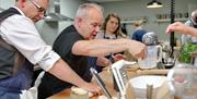 Image shows pupils watching chef demonstration