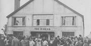 Historical black and white photograph of crowd gathered outside the Rinkha in Islandmagee