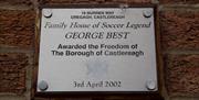 Plaque commemorating George Best being awarded Freedom of the Borough of Castlereagh