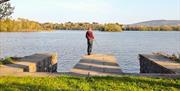 Boy fishing from the jetty at Shamrock Cottage.