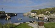 Small boats docked at Ballintoy Harbour