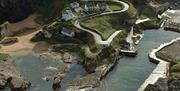 An aerial view of Ballintoy Beach Cottage and Ballintoy Harbour.