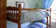 Bunk bedroom showing top  bunk and decor