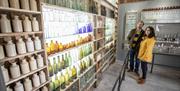 Friends looking at  the impressive Bottle Room and displays in Montalto Estate, Ballynahinch.