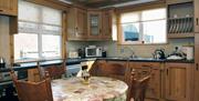 kitchen and dining area with table and 4 chairs