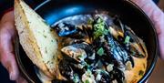 Bowl of local shell fish and bread