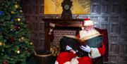 Father Christmas checking the Nice List