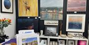 Display of various sizes of wall mounted art