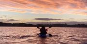 Paddlers at Sunset