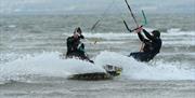 Kite surfers on the water