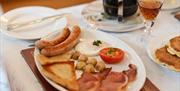 Breakfast fry served with side plate of pancakes