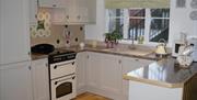 kitchen area with cream cabinets