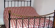 A red and white checkered bed.